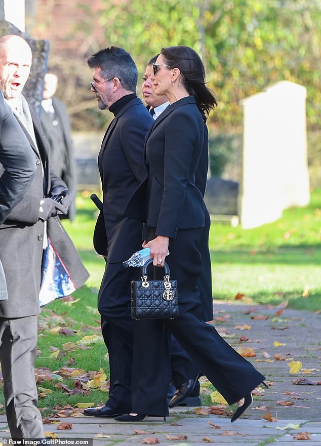 Cowell arrived at the funeral with his wife Laura Silverman.