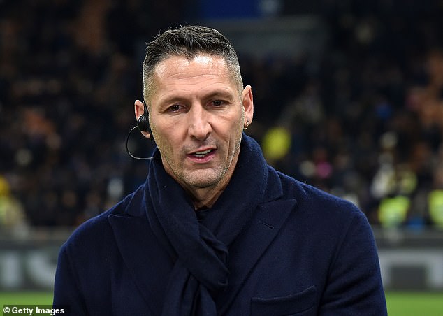 Materazzi (above) has revealed he is finally ready to bury the hatchet with the French legend