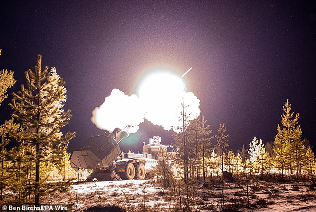 Snowflakes illuminate during the actual firing of the British Army's new Archer Mobile Howitzer cannon near Rovaniemi in the Arctic Circle.