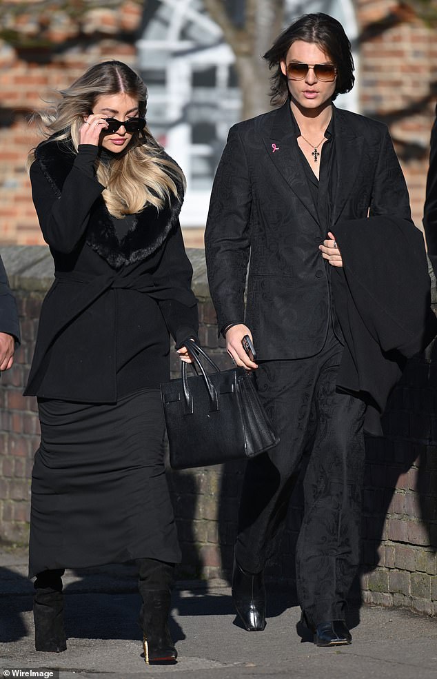 Ms Cassidy (left) was seen arriving at St Mary's Church, dressed in a long black coat with fur trim and sunglasses, alongside Damien Hurley.