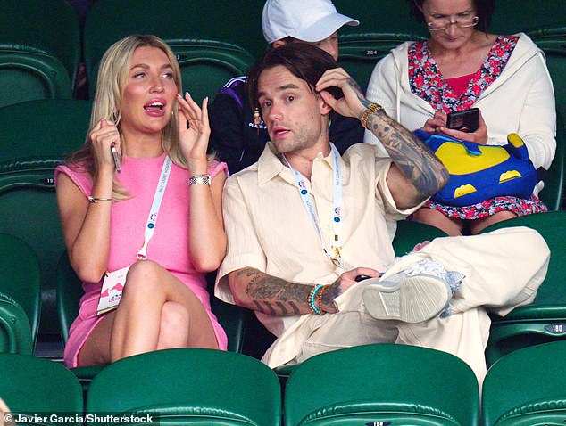 Payne and Cassidy watching on Center Court at Wimbledon last year