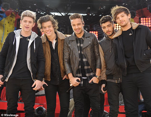 Payne rose to fame with the band One Direction. He is pictured with his bandmates in 2013.