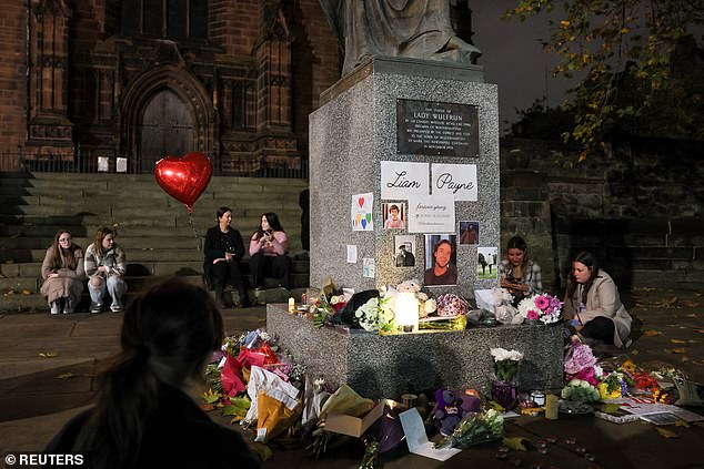 Tributes and flowers are laid outside St Peter's Collegiate Church to remember former One Direction singer Liam Payne in Wolverhampton.