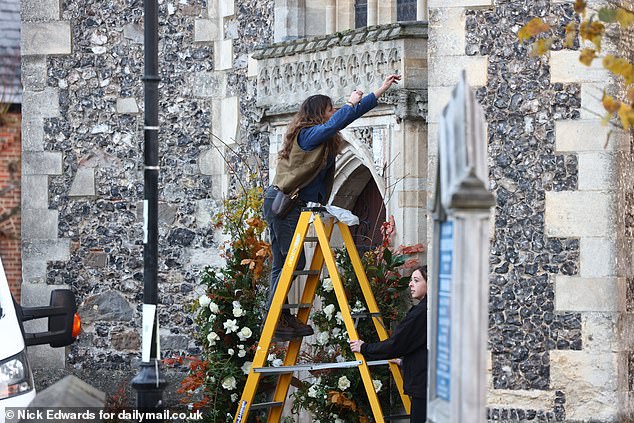 Flower arrangements outside the entrance to the church where his funeral takes place.