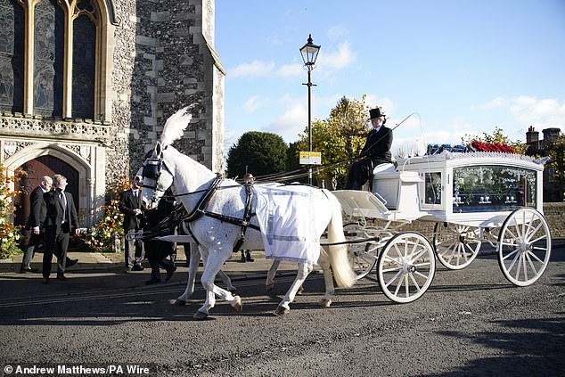 A horse-drawn carriage carrying Liam Payne's coffin arrives for the One Direction singer's funeral at St Mary's Church in Amersham.