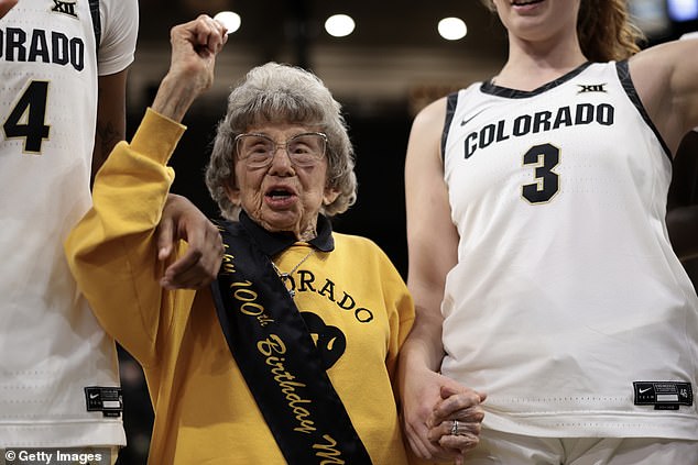 Colorado Buffaloes super fan Miss Peggy Coppom celebrates her 100th birthday with the Colorado Buffaloes women's basketball team on Tuesday.