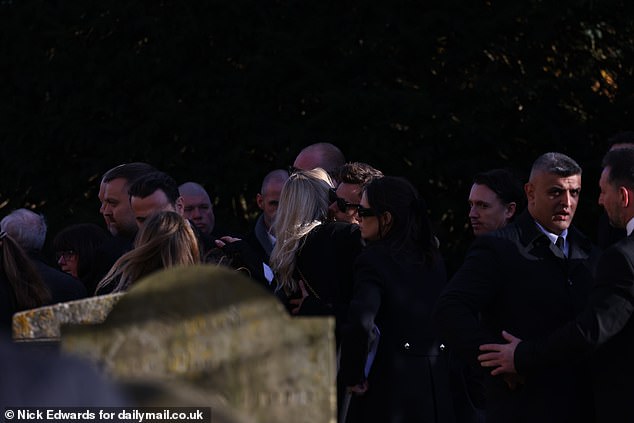 Harry Styles embraces mourners outside the church after a service for Liam Payne today