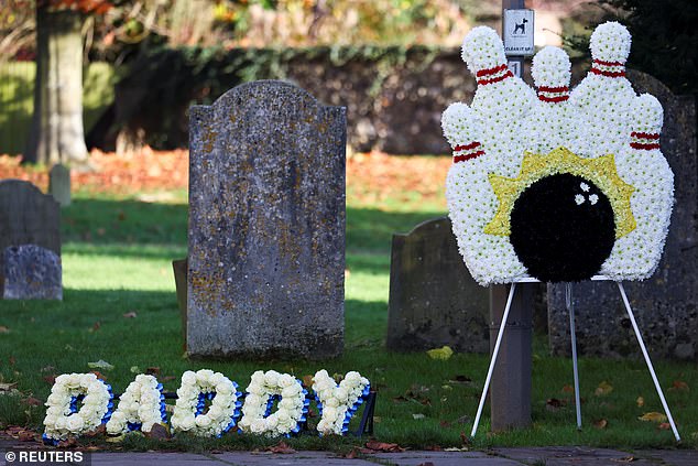 A floral tribute with the text 'Daddy'. Payne shared a seven-year-old son with his ex-girlfriend, Cheryl Tweedy