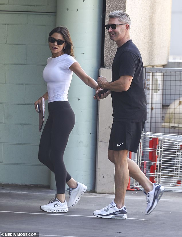 Proving he has ignored the alleged snub, Michael, 43, was smiling as he walked hand in hand with Arabella, 32, as they enjoyed the sunny Sydney weather.