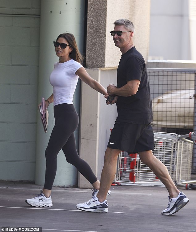 The couple, whose romance first came to light in June, looked as in love as ever and couldn't keep their hands off each other during the stroll.