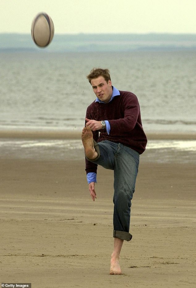 The prince kicks a rugby ball barefoot on St Andrews beach in 2003.