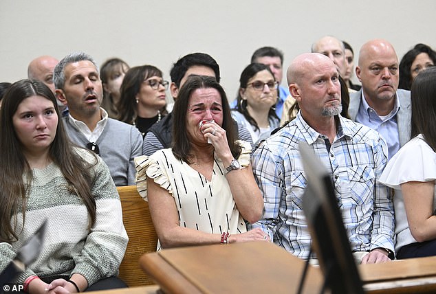 Riley's parents Allyson and John Phillips (center and right) were filled with emotion as the trial started Friday