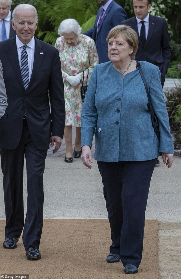 Biden, seen here walking with German Chancellor Angela Merkel at the G7 Summit on June 11, 2021. In an anecdote he told to donors twice on Wednesday in New York, he said the chancellor at the time was Helmut Kohl.