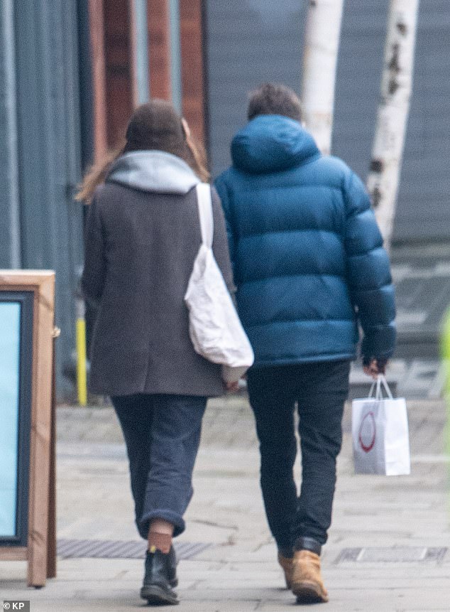 The couple stopped at a cafe to grab a takeaway while enjoying their walk.