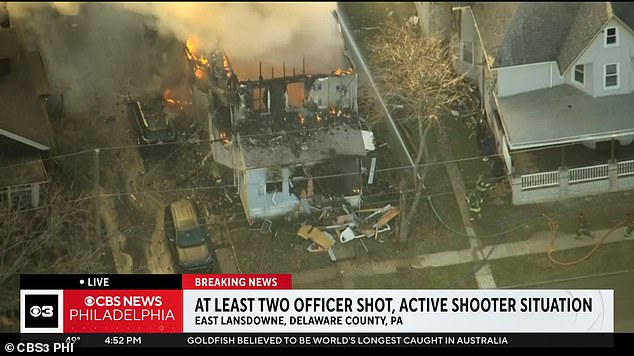 Two police officers were shot during an active shooter situation near Philadelphia at a house that was set on fire.