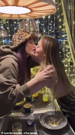 Vlada and Vika kissing. They were chased by the police and will also face heavy fines for disobeying laws prohibiting 