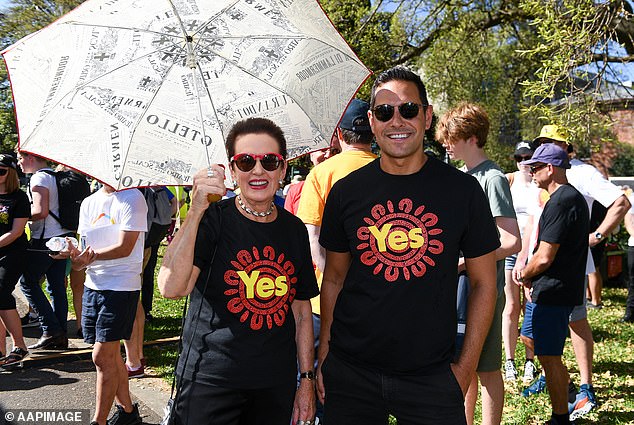 In a wide-ranging New Year's Eve speech, Mrs Moore (pictured wearing a Yes T-shirt and holding an umbrella) called for 