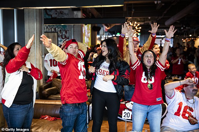 The phenomenon dubbed 'Super Sick Monday' is so common that it has sparked petitions and legislative efforts to designate it as an official holiday (Pictured: Fans react while watching the San Francisco 49ers play the Kansas City Chiefs during a Super Bowl LIV in 2020)