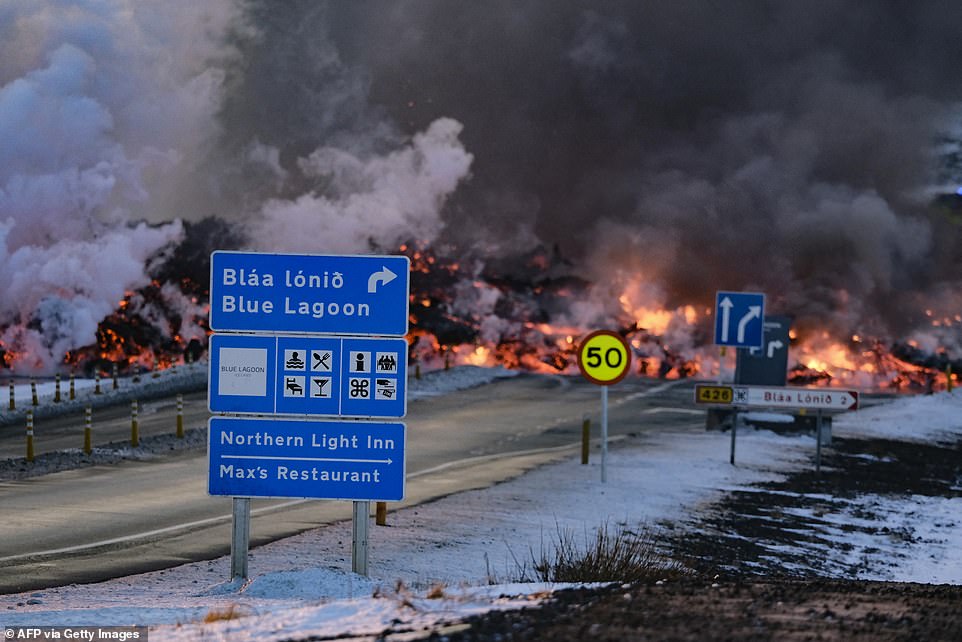 After the eruption, one of Iceland's biggest attractions, the Blue Lagoon thermal spa, was evacuated (pictured: a sign directing drivers to Iceland's Blue Lagoon spa is seen in front of the lava)