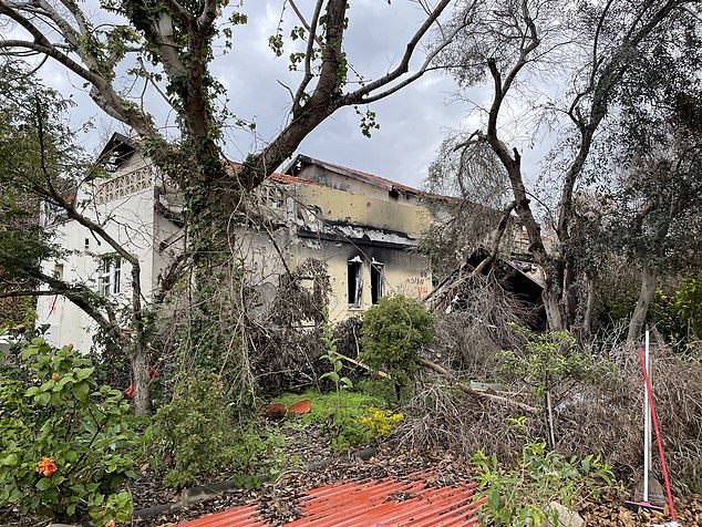Another house is seen on Wednesday at Kibbutz Be'eri, its roof blackened and its garden overgrown with weeds. Homes have been abandoned and residents have been killed in the Hamas attack or taken refuge elsewhere in Israel further from the Gaza border.