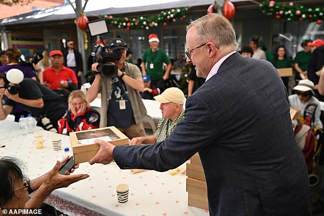 Australians are feeling the pressure now more than ever. The Prime Minister helped serve the free Christmas lunch on December 25.