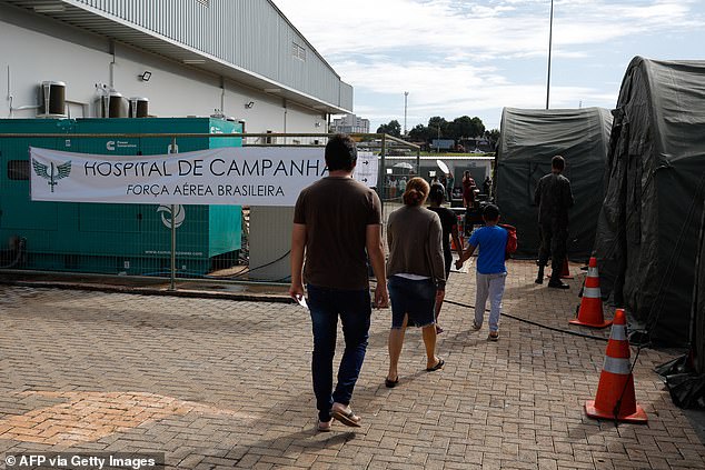 Patients attend a makeshift military aid post set up to treat suspected dengue cases in the administrative region of Ceilandia, outside Brasilia, on February 6.