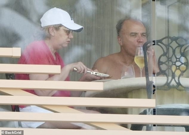 She was photographed for the first time since that announcement on December 27, enjoying a glass of wine with Dr Adib on the balcony of her luxury Burleigh Heads apartment.