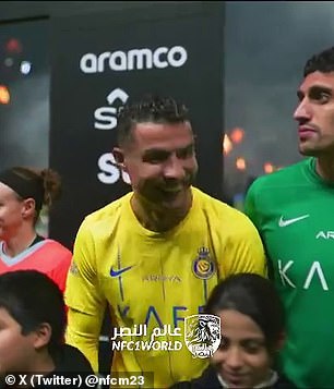 Cristiano Ronaldo laughed with his teammates while looking at the WWE star