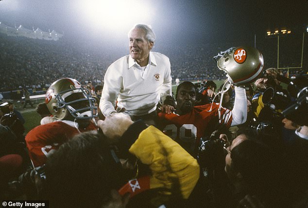 San Francisco 49ers coach Bill Walsh is carted off the field after winning Super Bowl XXIII