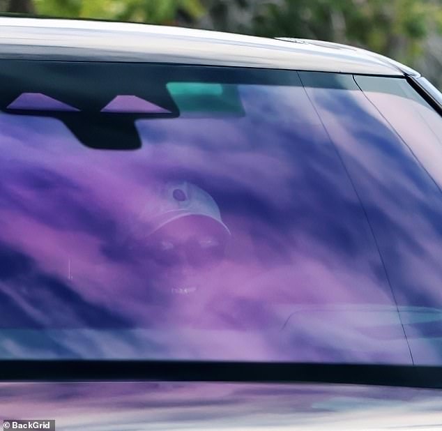 Meghan was all smiles as she drove near the couple's $14.65 million Montecito home on Wednesday.
