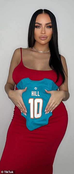 Brittany Lackner, the first of Hill's two new moms, came forward in January and said she and Hill had sex in Florida the year before and that she was due to give birth in a few days. She is shown holding a Hill's Dolphin t-shirt jumpsuit.