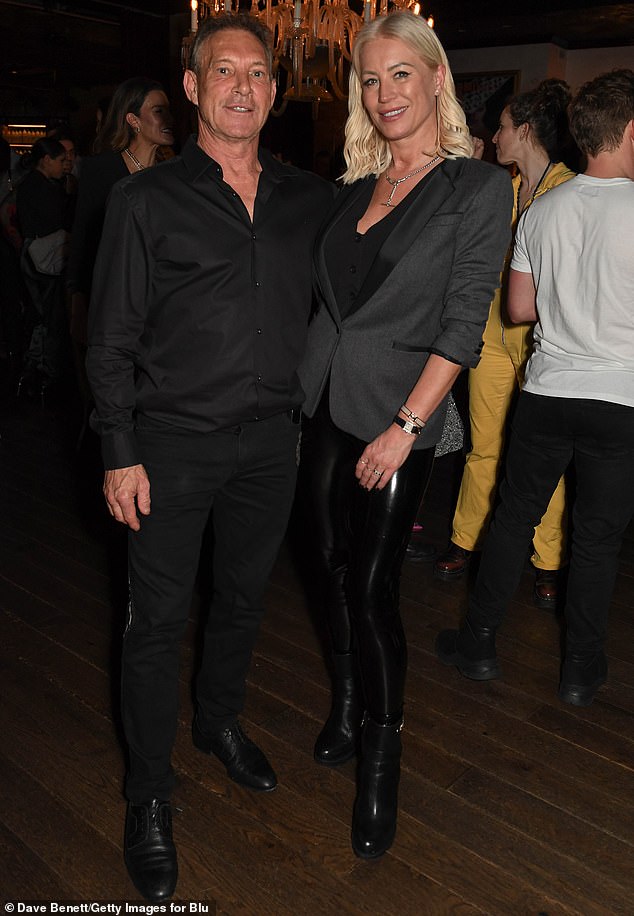 Denise van Outen, 49, wore shiny black leggings and a gray jacket and posed with club owner Jelle Oomes.