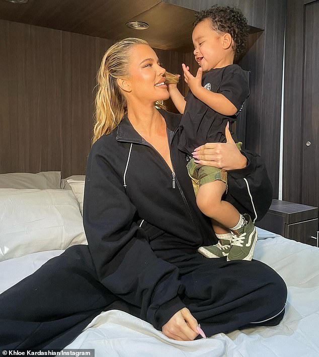 The businesswoman, whose clothing company is currently being sued by a former employee, wore a black tracksuit as she posed for the adorable snaps.