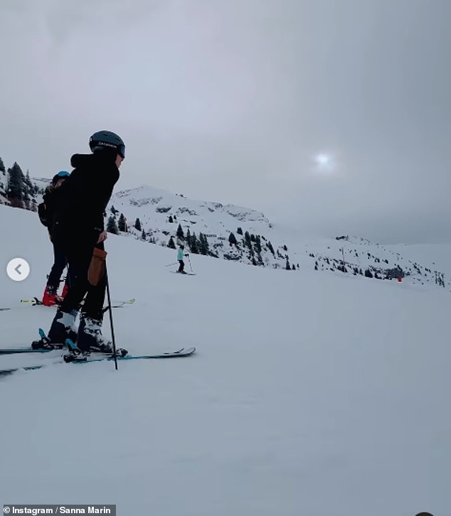 In addition to posting a photo of the views of the Alps, the mom shared a video of herself taking a break from snowboarding and sitting on top of the slopes.