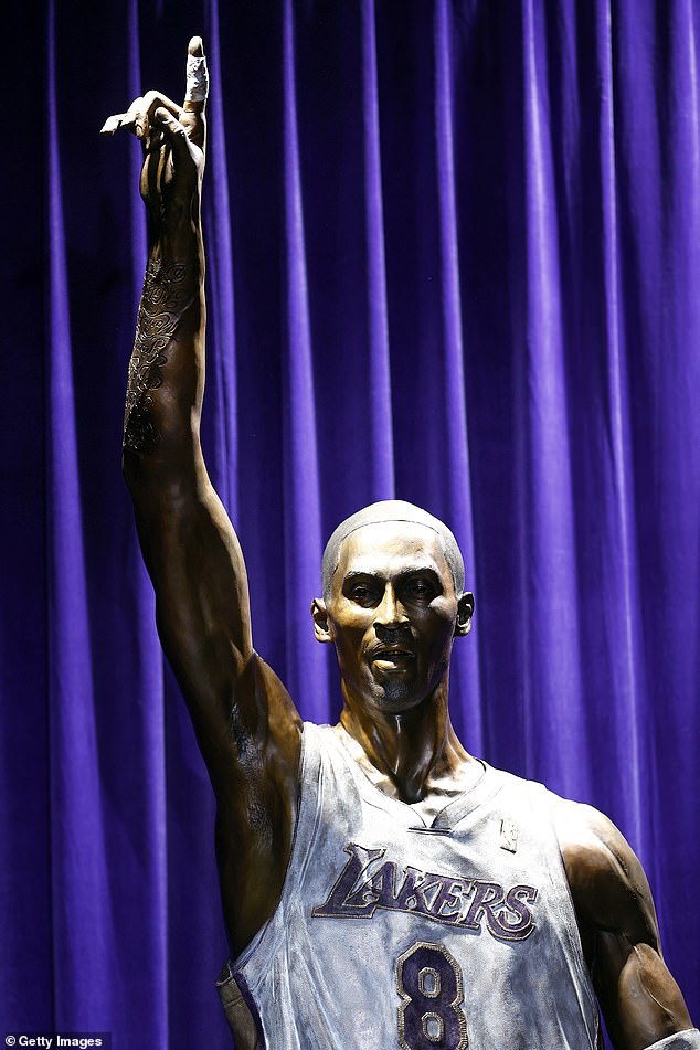The 4,000-pound statue depicts Bryant wearing his white No. 8 jersey with his index finger raised.