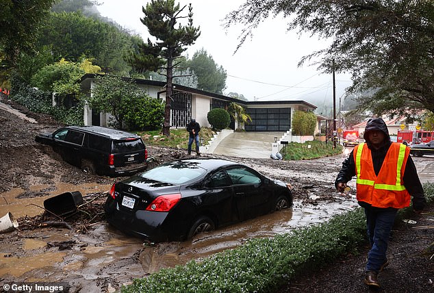 Meanwhile, 130 miles off the coast of San Diego, roads have turned into rivers and officials warned residents not to drive to work Tuesday morning.
