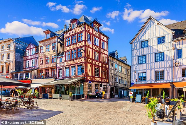 John says Rouen's half-timbered houses (pictured) look like a 'Hollywood set for a Robin Hood movie'