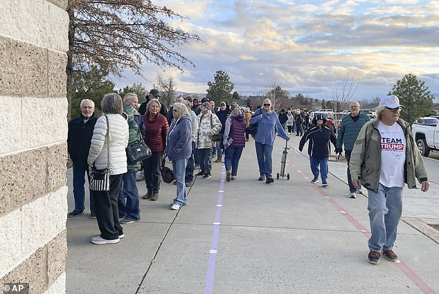 Nevada voters wait in line to enter a caucus site at Spanish Springs Elementary School in Sparks, Nevada, on Thursday, Feb. 8, following Tuesday's primary election where Nikki Haley lost to 