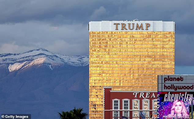 Trump held his late-night caucus party at the Treasure Island Hotel & Casino, seen at its peak as the former president's famous gold Trump Tower Hotel looms over the Las Vegas Strip.