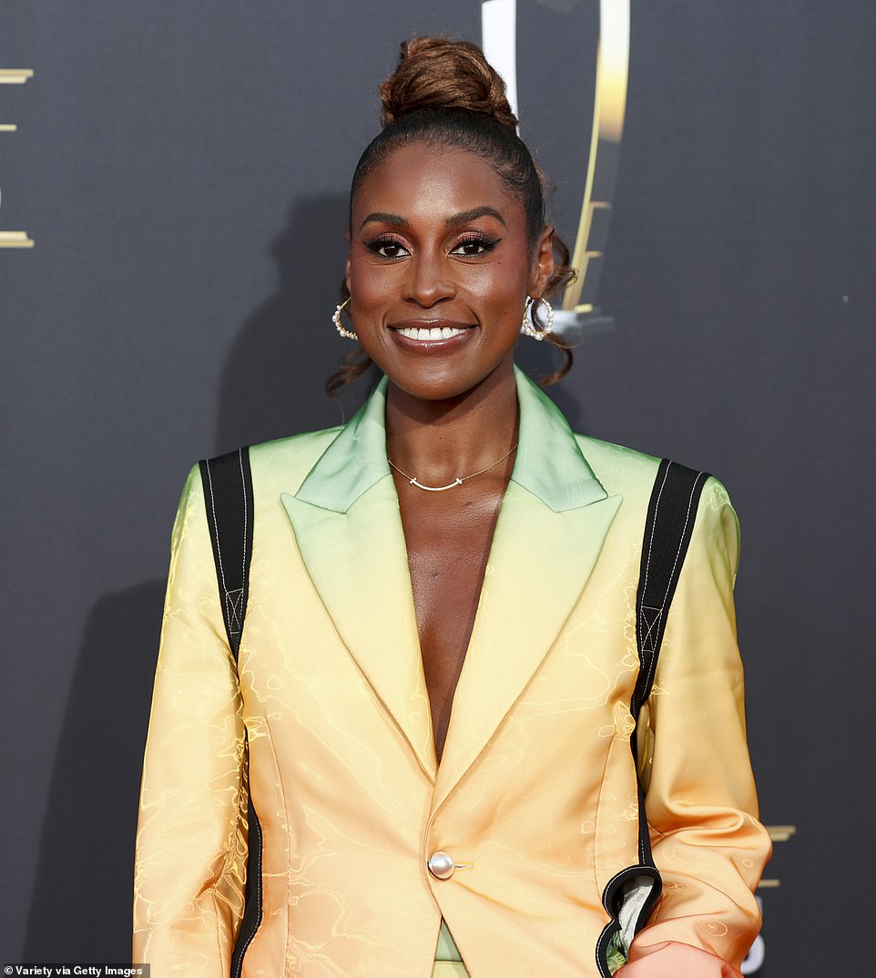 The Insecure alum, 29, wowed in a chic Christopher John Rogers single-breasted jumpsuit with an ombre rainbow print.