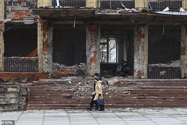 Ukraine actually declared independence from Russia in 1991 after the collapse of the USSR. Historically, the country has also been governed by Lithuania and Poland, neither of which attempt to assert rights over the country. In the photo: A couple walks near the rubble of destroyed buildings in Kupiansk, Kharkiv region, Ukraine.