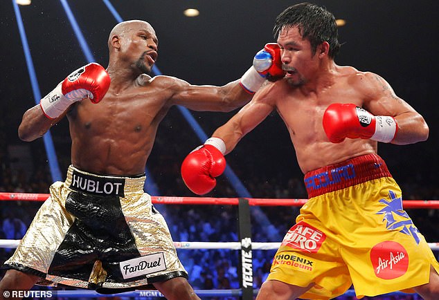 Manny Pacquiao (right) has revealed that he is in talks to arrange a rematch against Mayweather.