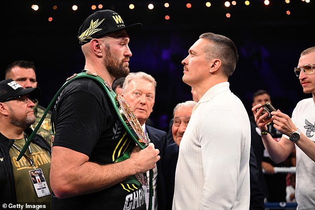 Fury (left) was originally due to fight Usyk on February 17 before the news broke on Friday.