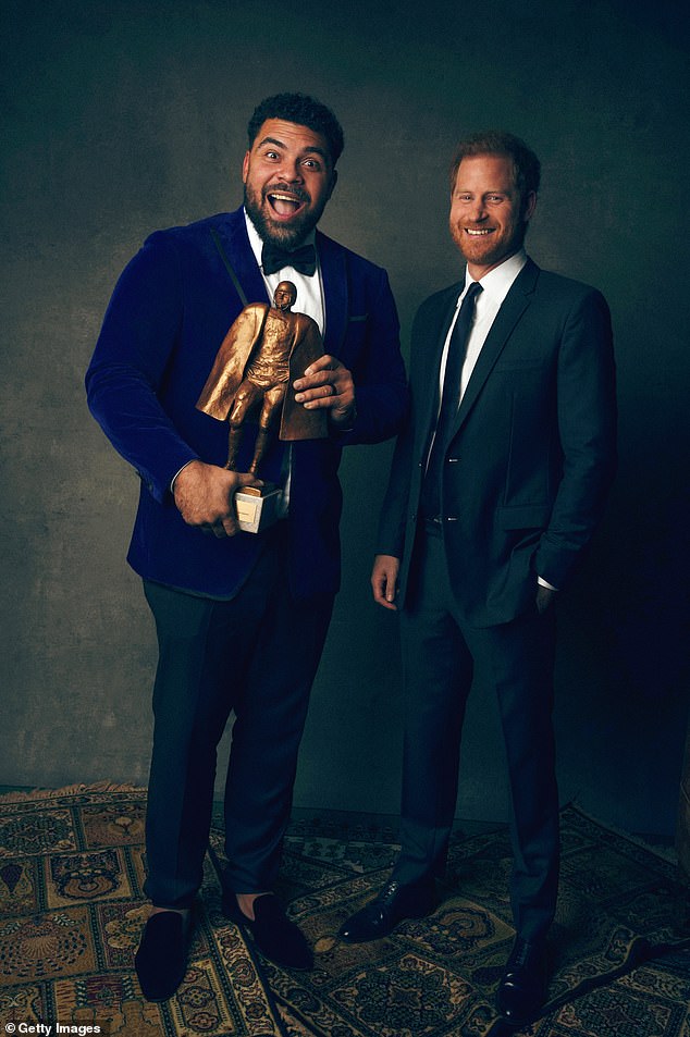 An animated Cameron Hayward of the Pittsburgh Steelers poses for a portrait after winning the Walter Payton Man of the Year award with Prince Harry, Duke of Sussex.