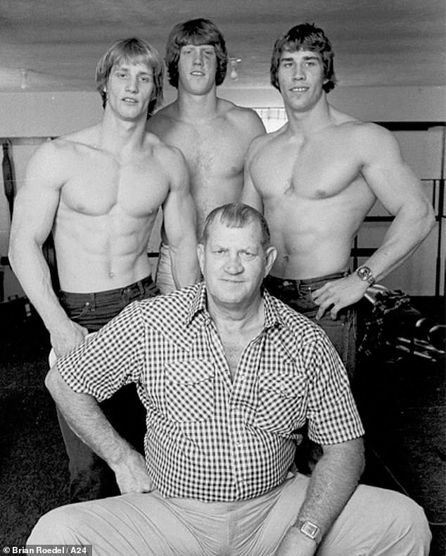 The Iron Claw follows the tragic true story of the Von Erich family, who made history by topping the world of professional wrestling in the early 1980s. Pictured: Brothers (left to right) Kevin, David and Kerry with his champion father, Fritz.