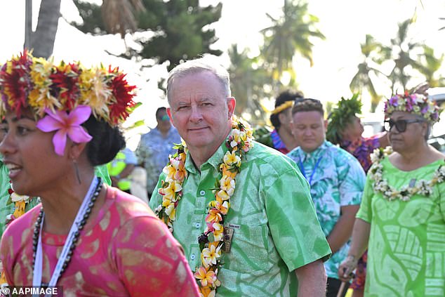 Bright colors were the order of the day when Anthony Albanese (pictured center) was welcomed to the Cook Islands.