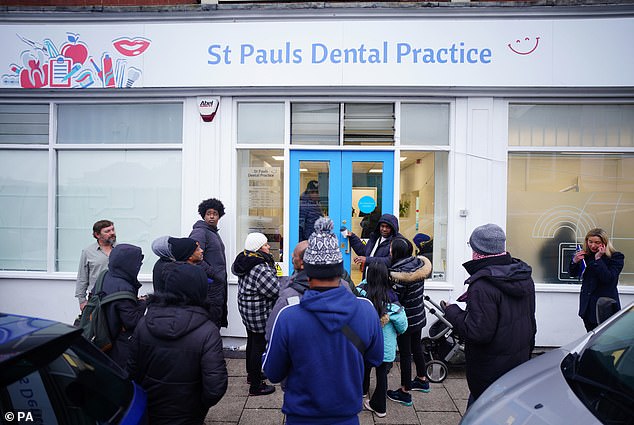 The police were even forced to turn away some patients. Pictured, patients outside St Pauls Dental Practice on Wednesday