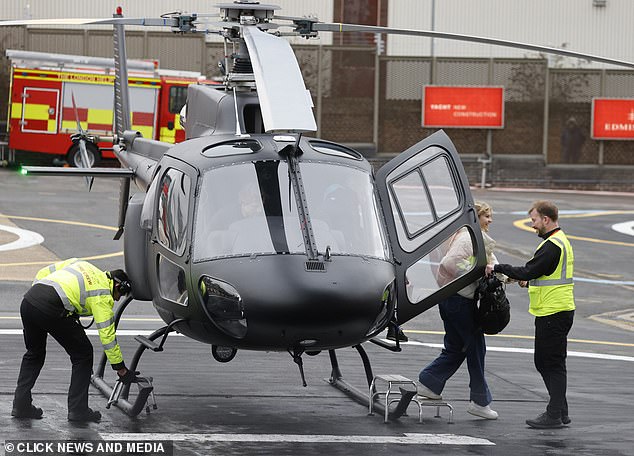 Tom and his companion were seen exiting the helicopter.