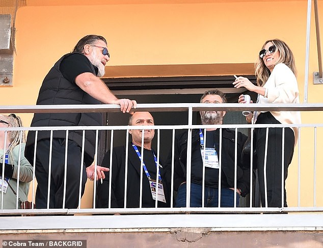 Britney enjoyed a drink while the couple sunbathed.