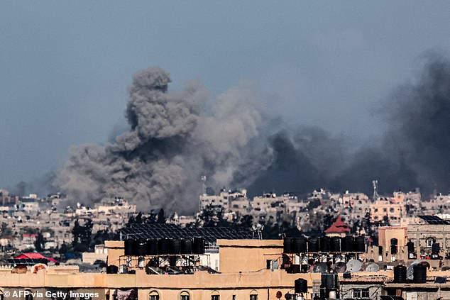 A photograph taken from Rafah shows smoke rising during the Israeli bombardment of Khan Yunis in the southern Gaza Strip on Friday.